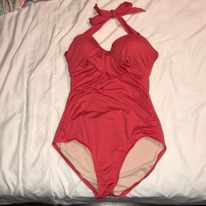 I am selling one piece pink bathing suit.